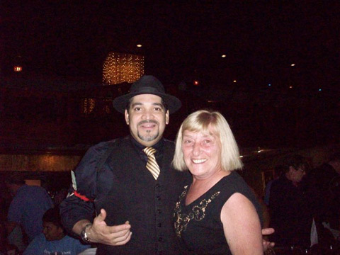 Vito poses with a guest at Capone's Dinner Theatre