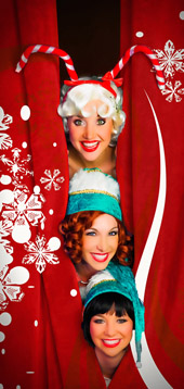 Elves playfully peek from the opening curtain at Capone's during the holidays
