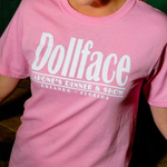 Pink dollface shirt with Capone's Dinner & Show imprint